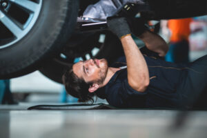 auto mechanic garage car service, repair and maintenance vehicle automobile, technician man person workshop for automotive engine and working with motor tool